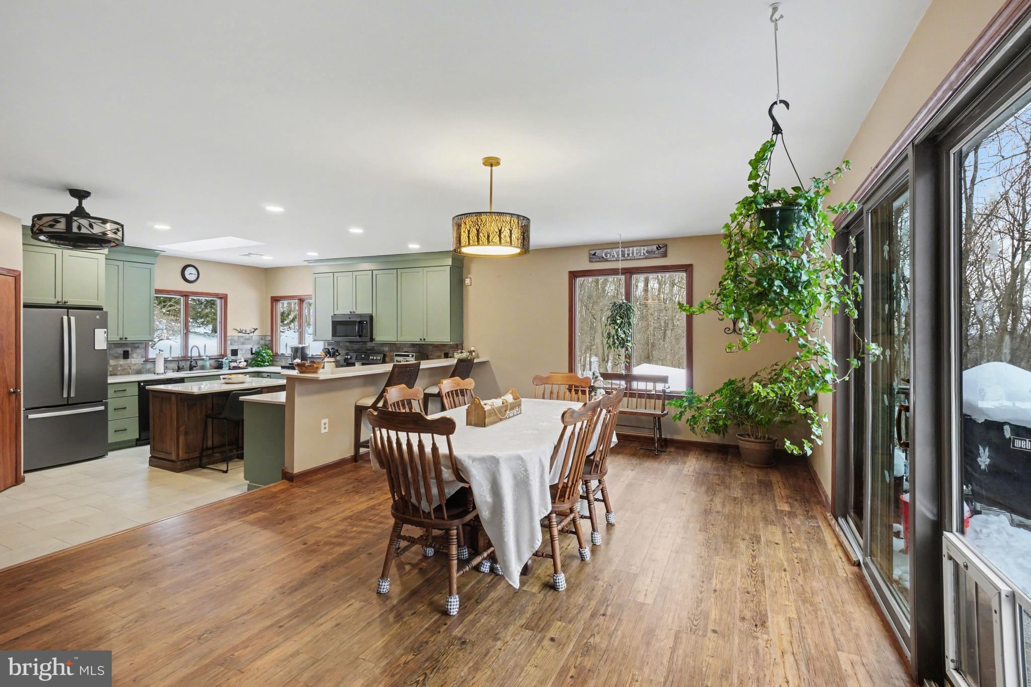 46 Wetzel Road Macungie, PA 18062 - Photo 7 of 42 a kitchen with a table chairs refrigerator and microwave