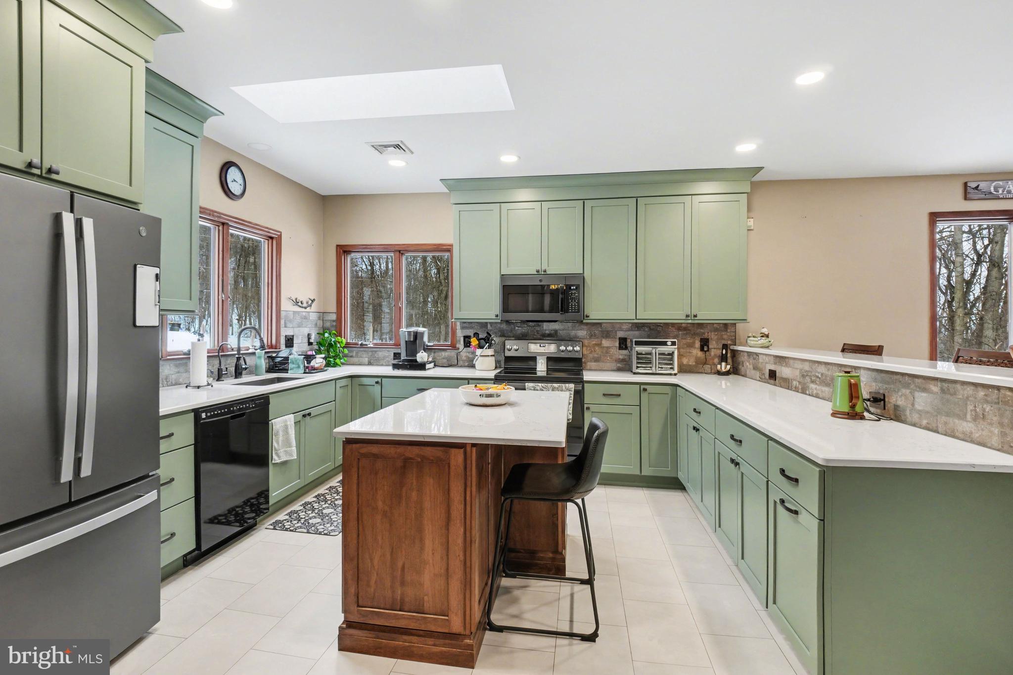 46 Wetzel Road Macungie, PA 18062 - Photo 9 of 42 a kitchen with counter top space appliances and cabinets