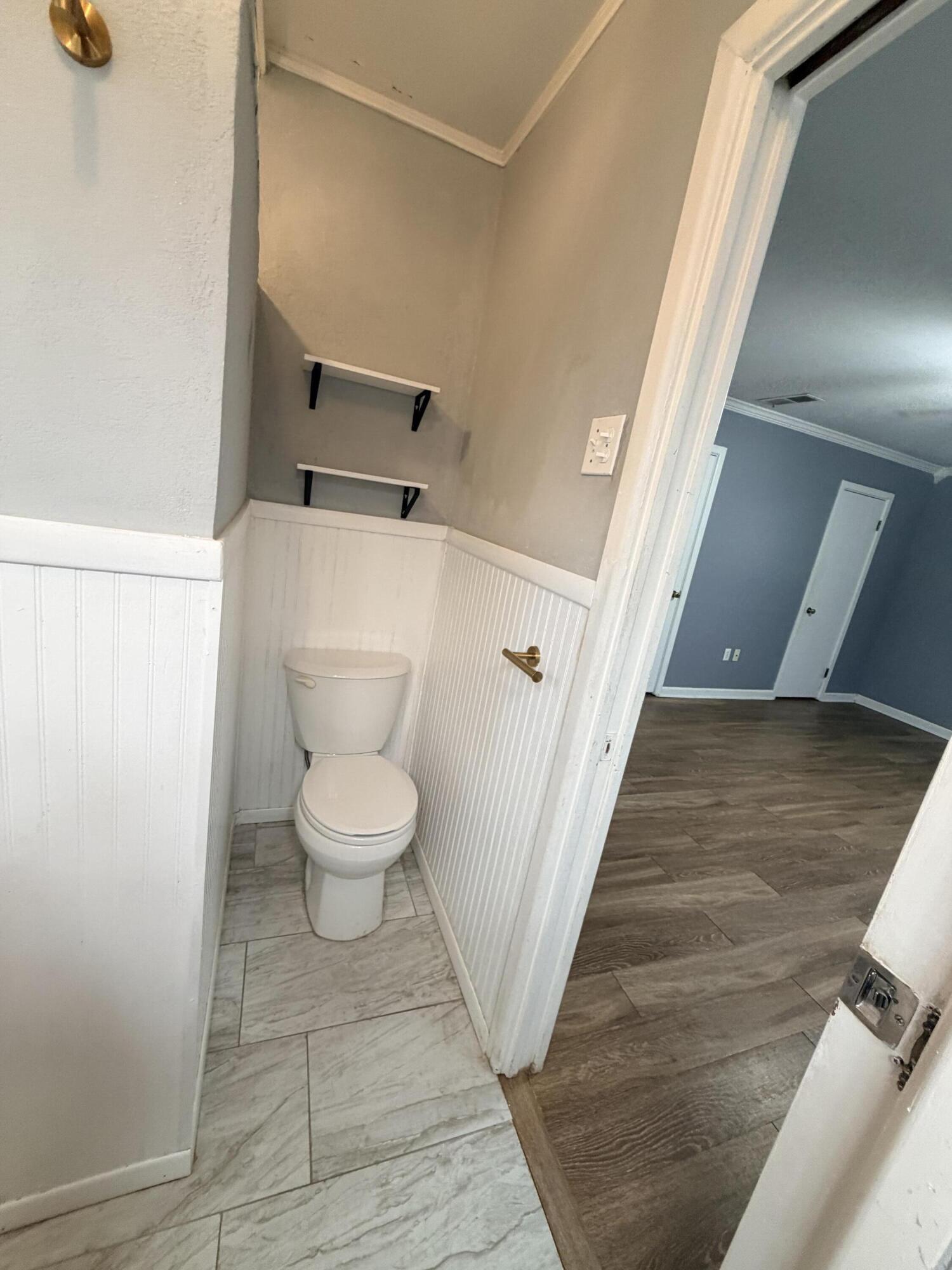 3814 27th Street Lubbock, TX 79410 - Photo 16 of 24 a bathroom with a toilet