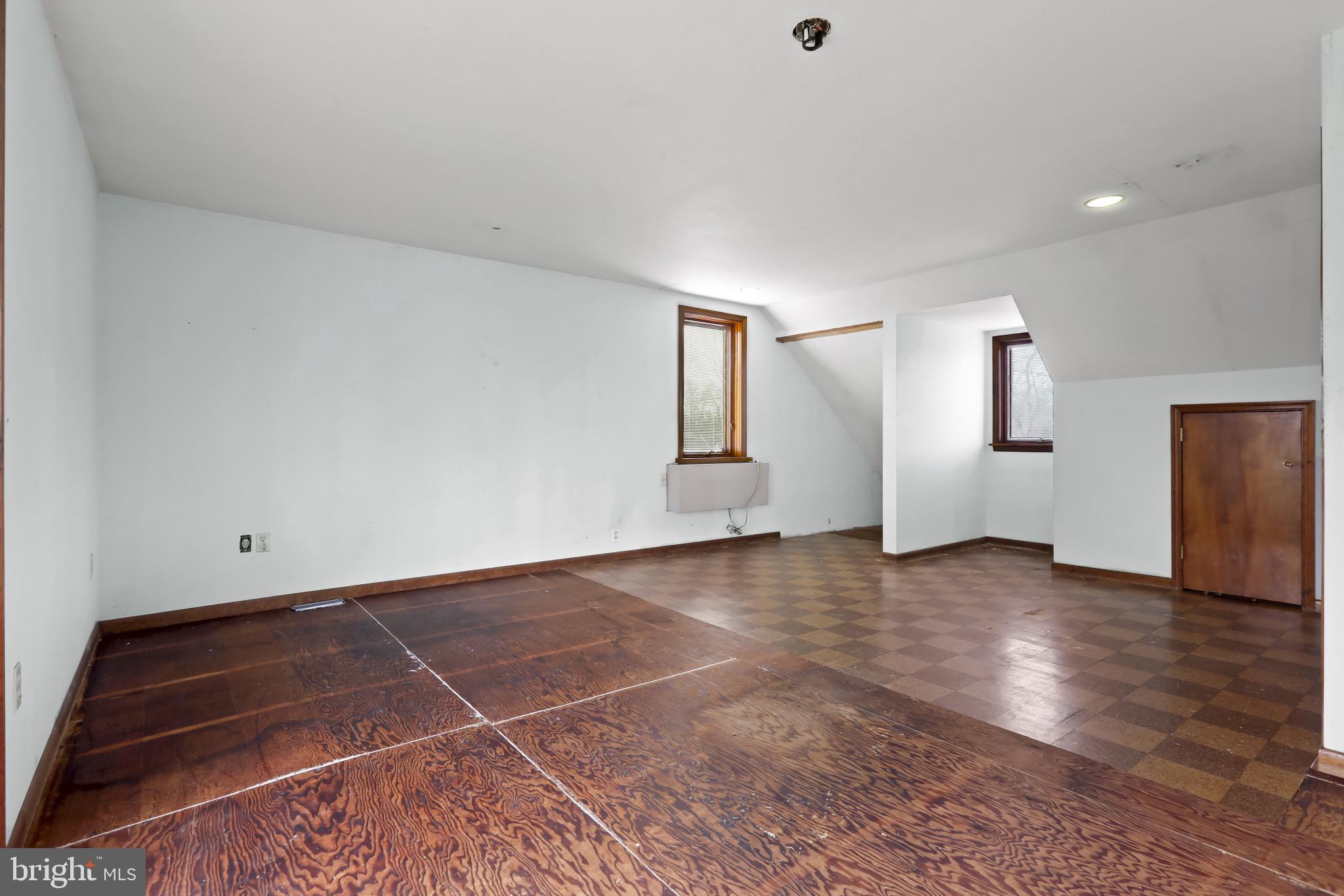 409 Oak Court Baltimore, MD 21228 - Photo 18 of 29 a view of a livingroom with wooden floor and stairs