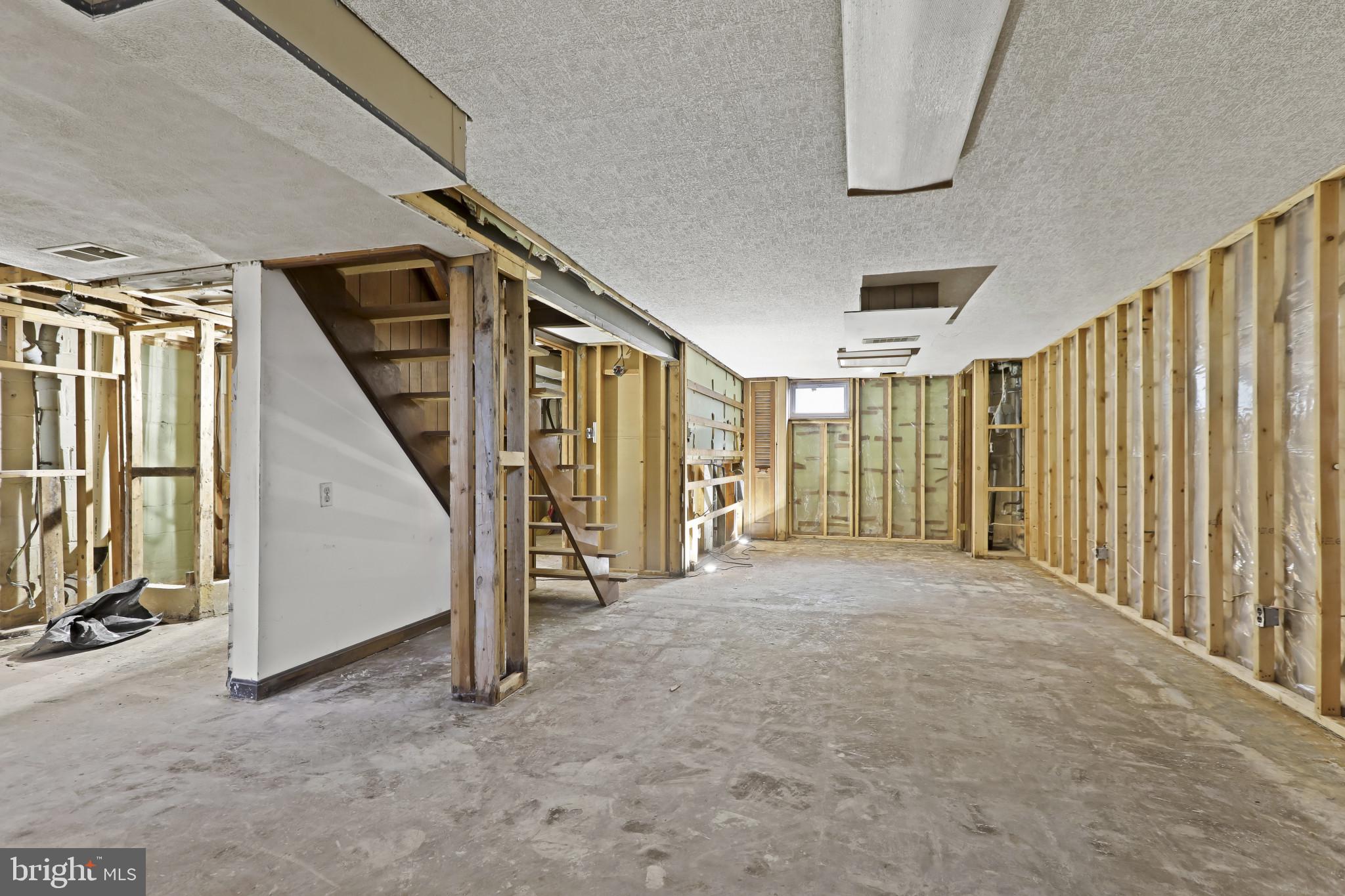 409 Oak Court Baltimore, MD 21228 - Photo 21 of 29 a view of an empty room with stairs