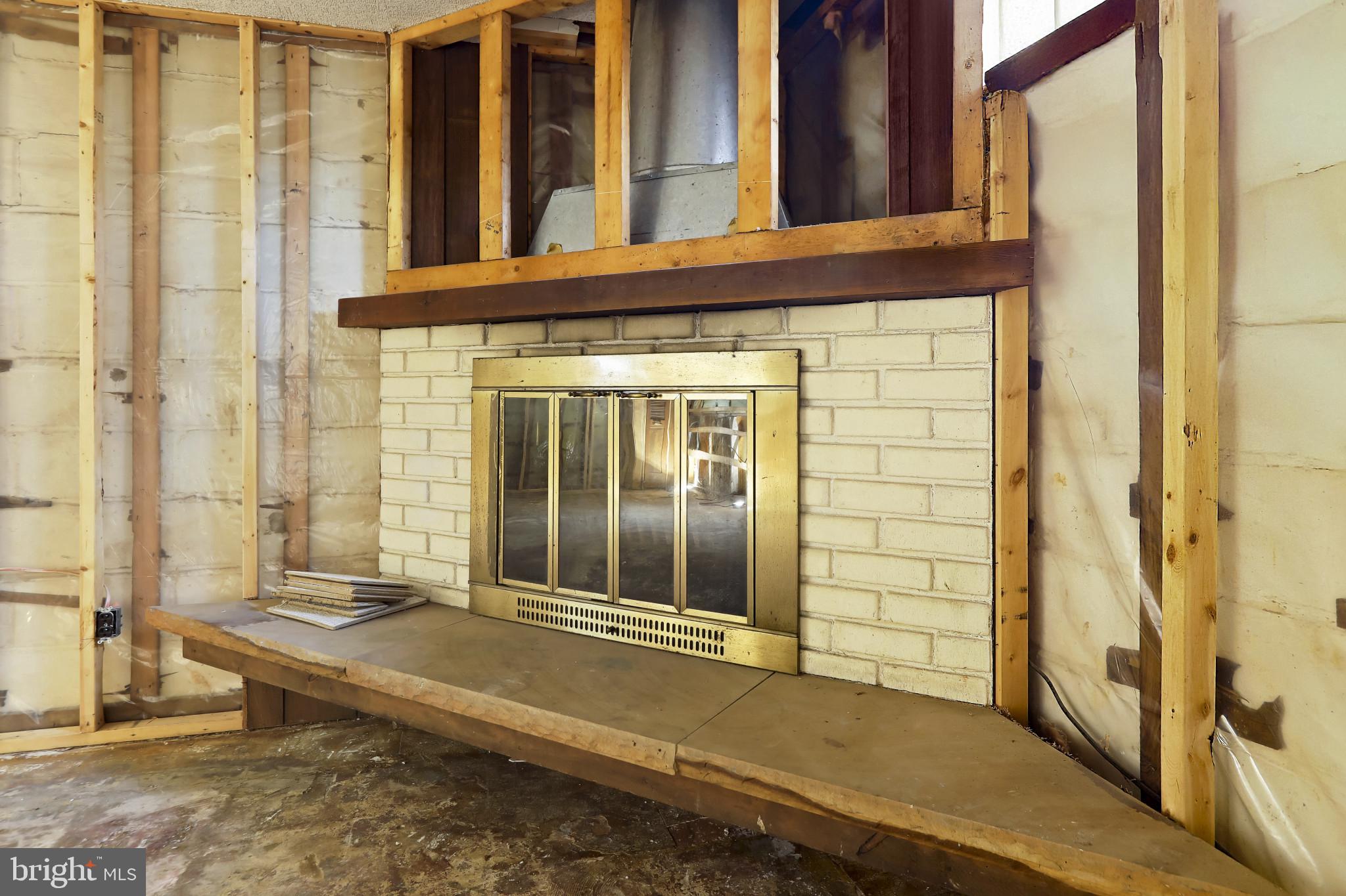 409 Oak Court Baltimore, MD 21228 - Photo 22 of 29 a view of a brick house with large windows
