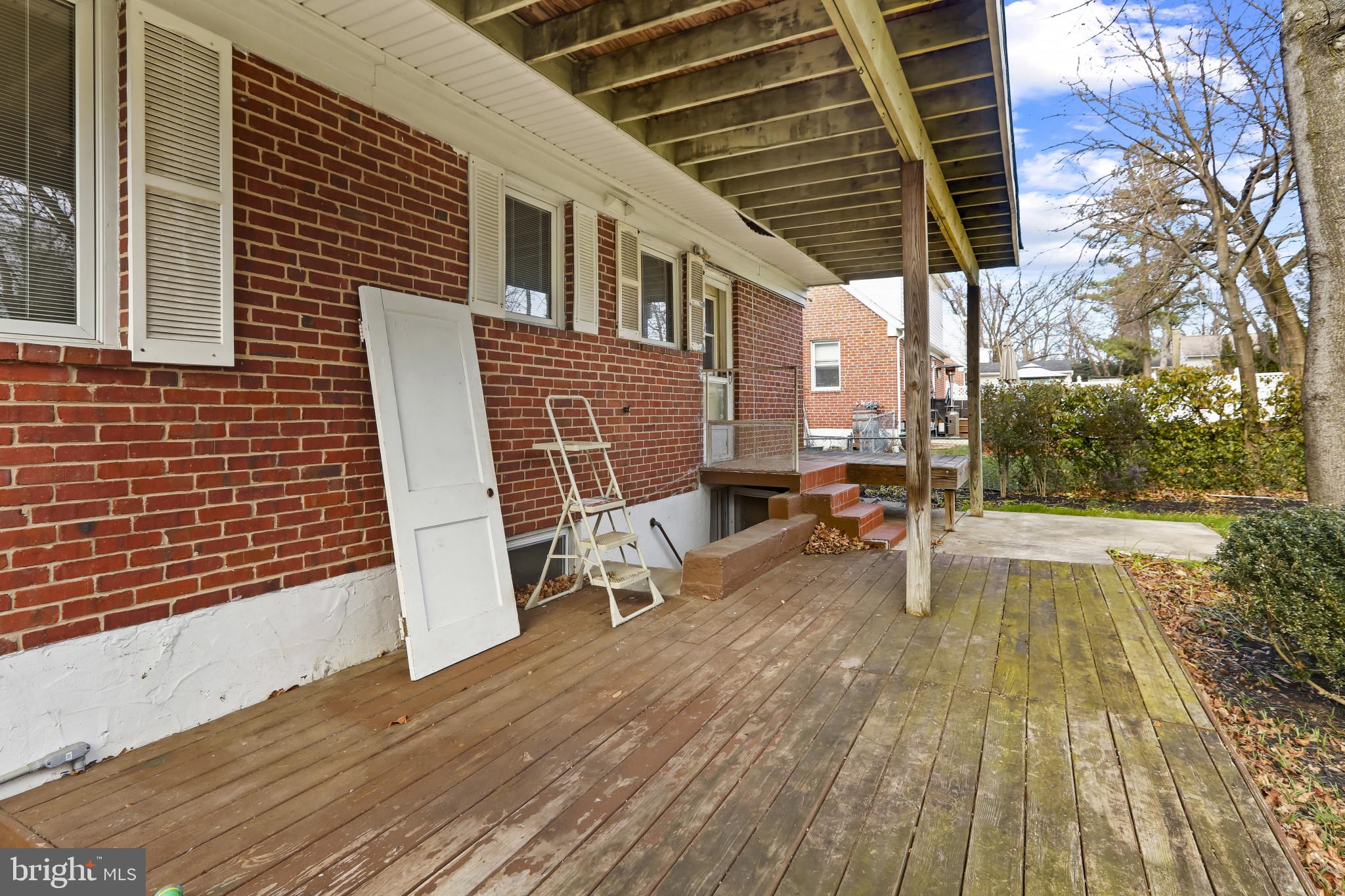 409 Oak Court Baltimore, MD 21228 - Photo 24 of 29 a view of a house with backyard and sitting area