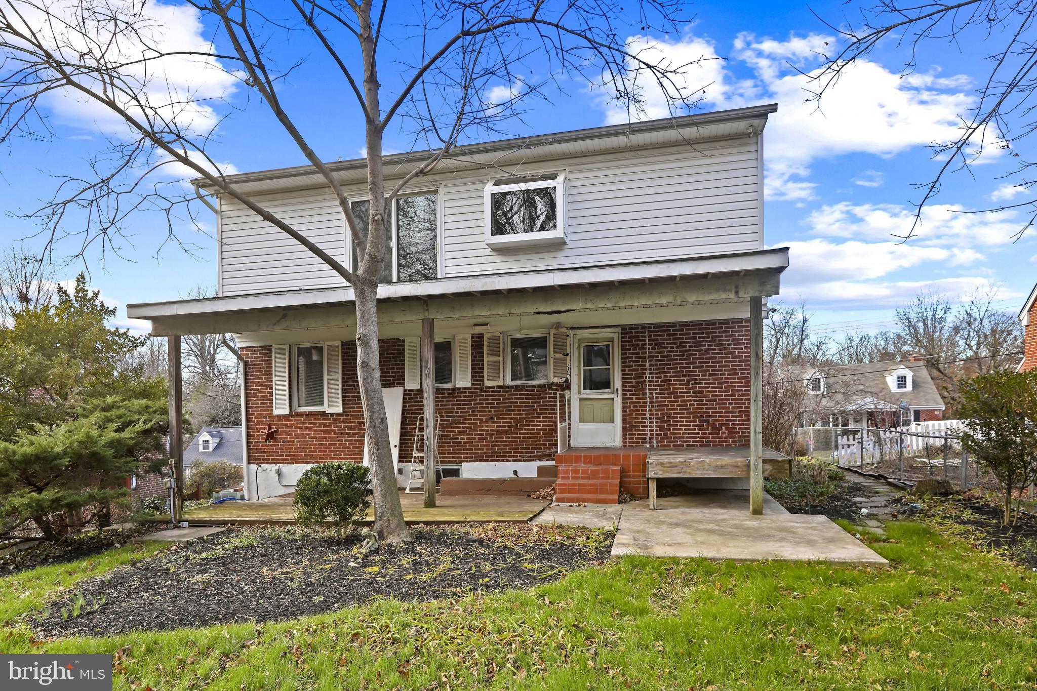 409 Oak Court Baltimore, MD 21228 - Photo 29 of 29 a front view of a house with garden