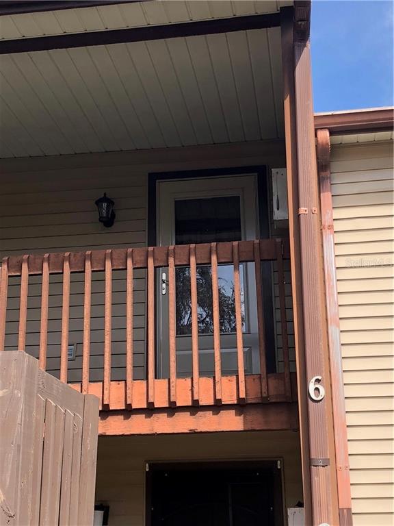 12041 Environmental Drive, Unit 6 New Port Richey, FL 34654 - Photo 1 of 1 a view of wooden balcony