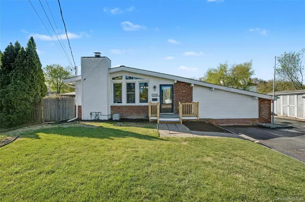 a house view with a backyard space