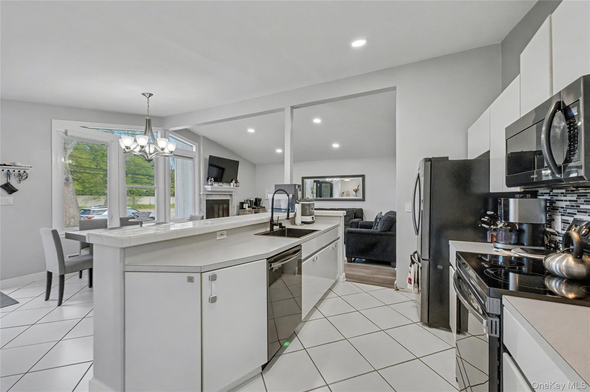 1298 Pulaski Road East Northport, NY 11731 - Photo 17 of 41 a kitchen with cabinets and chairs