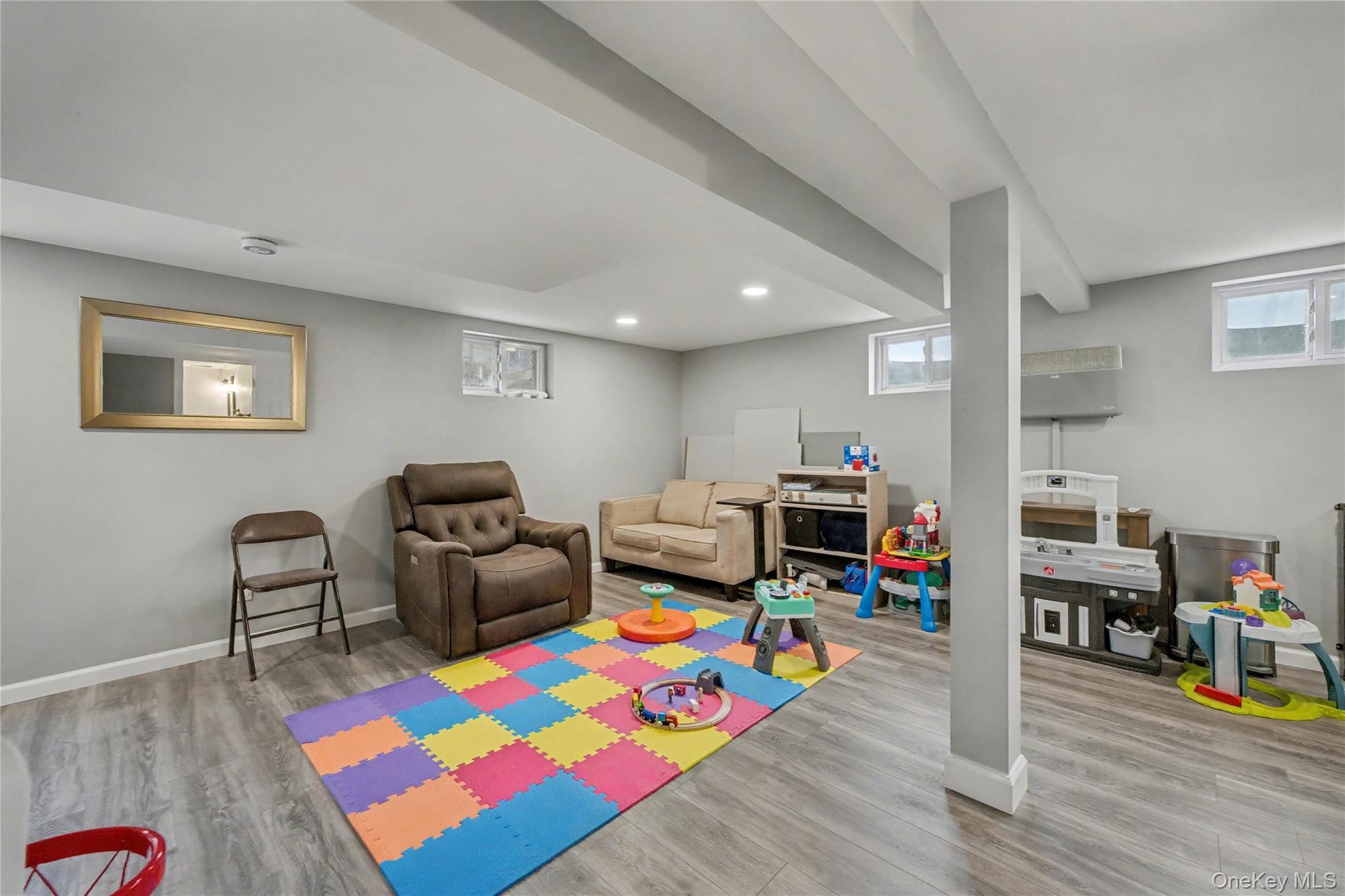 1298 Pulaski Road East Northport, NY 11731 - Photo 30 of 41 a living room with furniture and a wooden floor