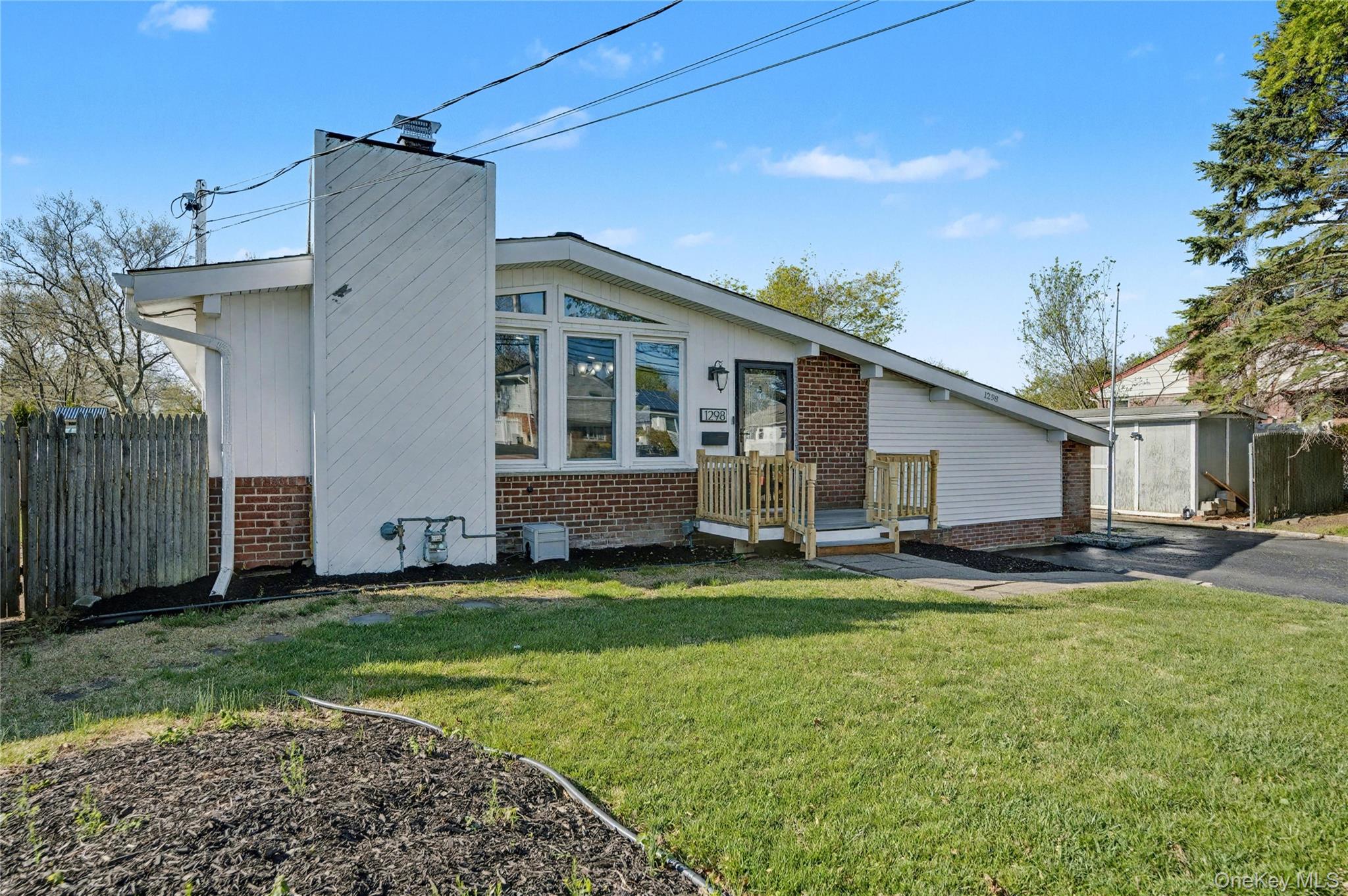1298 Pulaski Road East Northport, NY 11731 - Photo 3 of 41 a view of a house with a yard and sitting area
