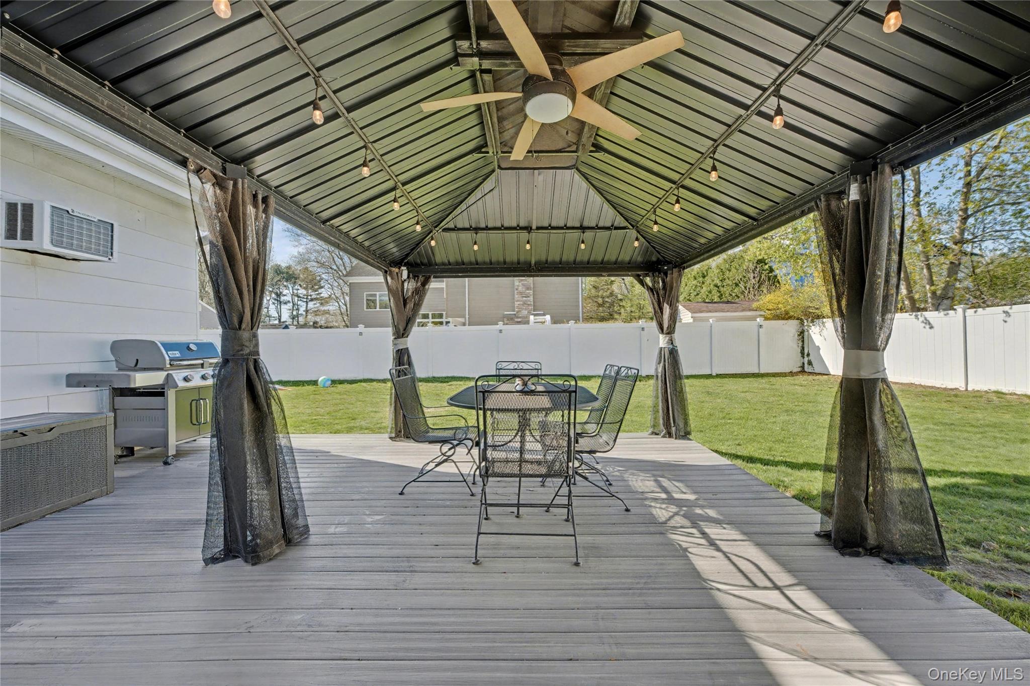 1298 Pulaski Road East Northport, NY 11731 - Photo 40 of 41 a patio with glass top table and chairs