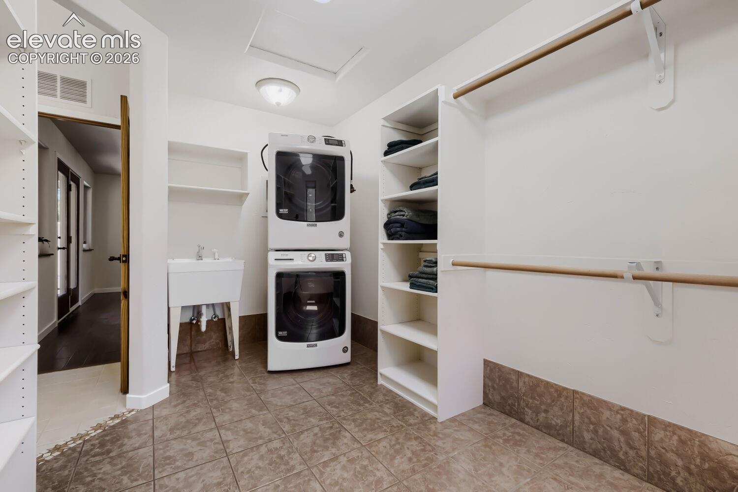 9890 Hardy Road Colorado Springs, CO 80908 - Photo 36 of 50 Primary closet with own laundry and sink