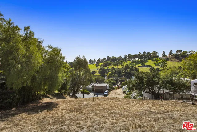 a view of a road with a building in the background