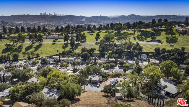 an aerial view of residential house with outdoor space and mountain view