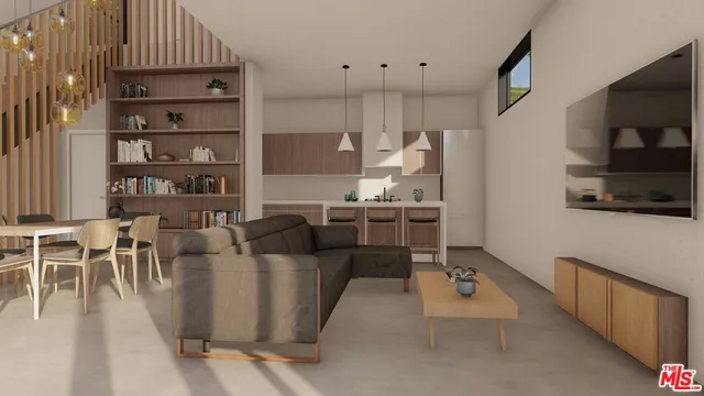 a living room with furniture a rug and kitchen view