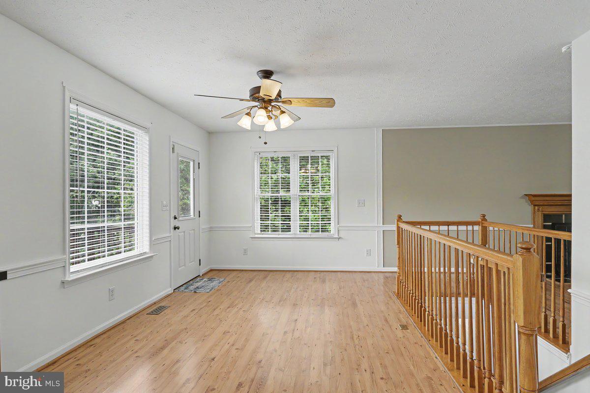 543 Whiskey Still Road Linden, VA 22642 - Photo 13 of 23 wooden floor in an empty room with a window