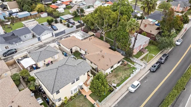 an aerial view of a house with a yard