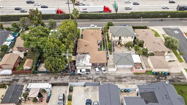 an aerial view of houses with a lake