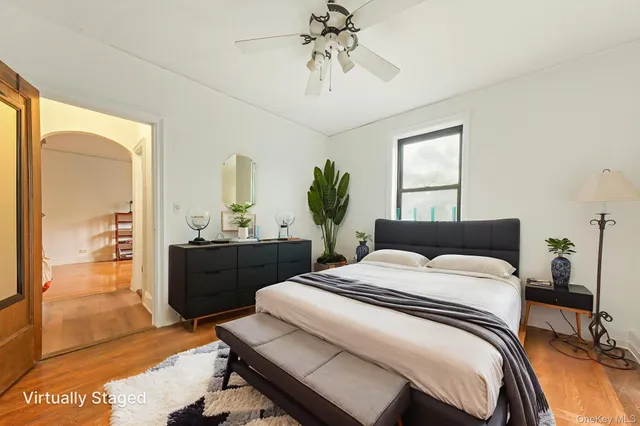 a living room with furniture and a kitchen