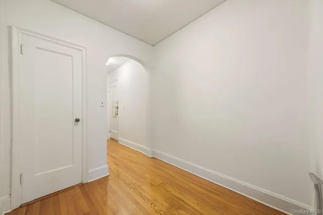 a view of room with wooden floor