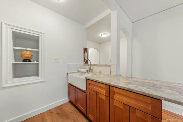 a view of a kitchen with wooden floor
