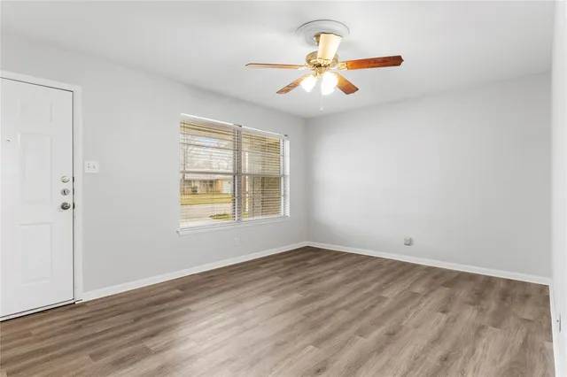 a kitchen with granite countertop a sink and steel appliances