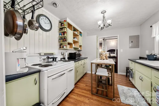 a kitchen with cabinets and stainless steel appliances