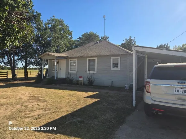a front view of a house with yard