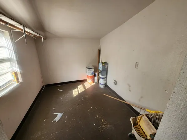 a view of room with hardwood flooring and couch