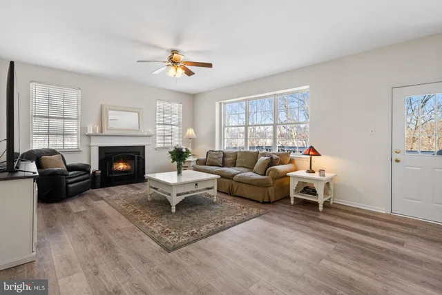 a view of a balcony with chairs and wooden floor