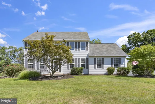 front view of a house with a garden