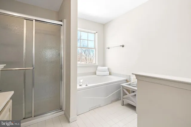 a view of a patio with couches table and chairs and potted plants