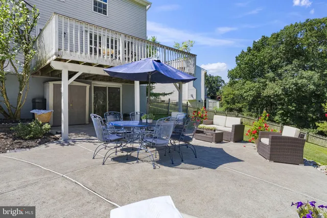 a view of a house with swimming pool and sitting area