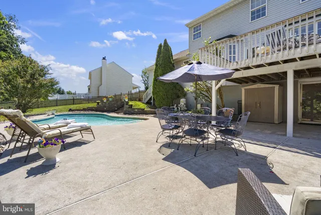 an aerial view of a house with a backyard