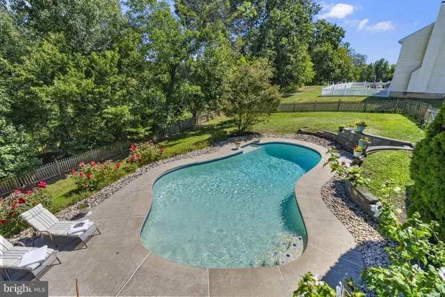 a view of a yard with a house in the background