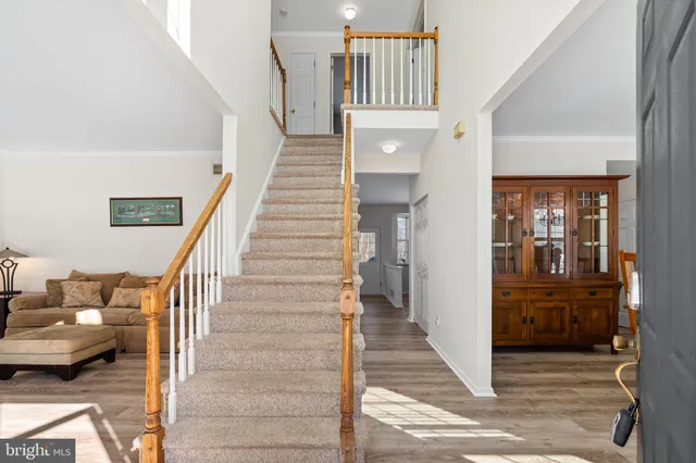 a living room with furniture and windows