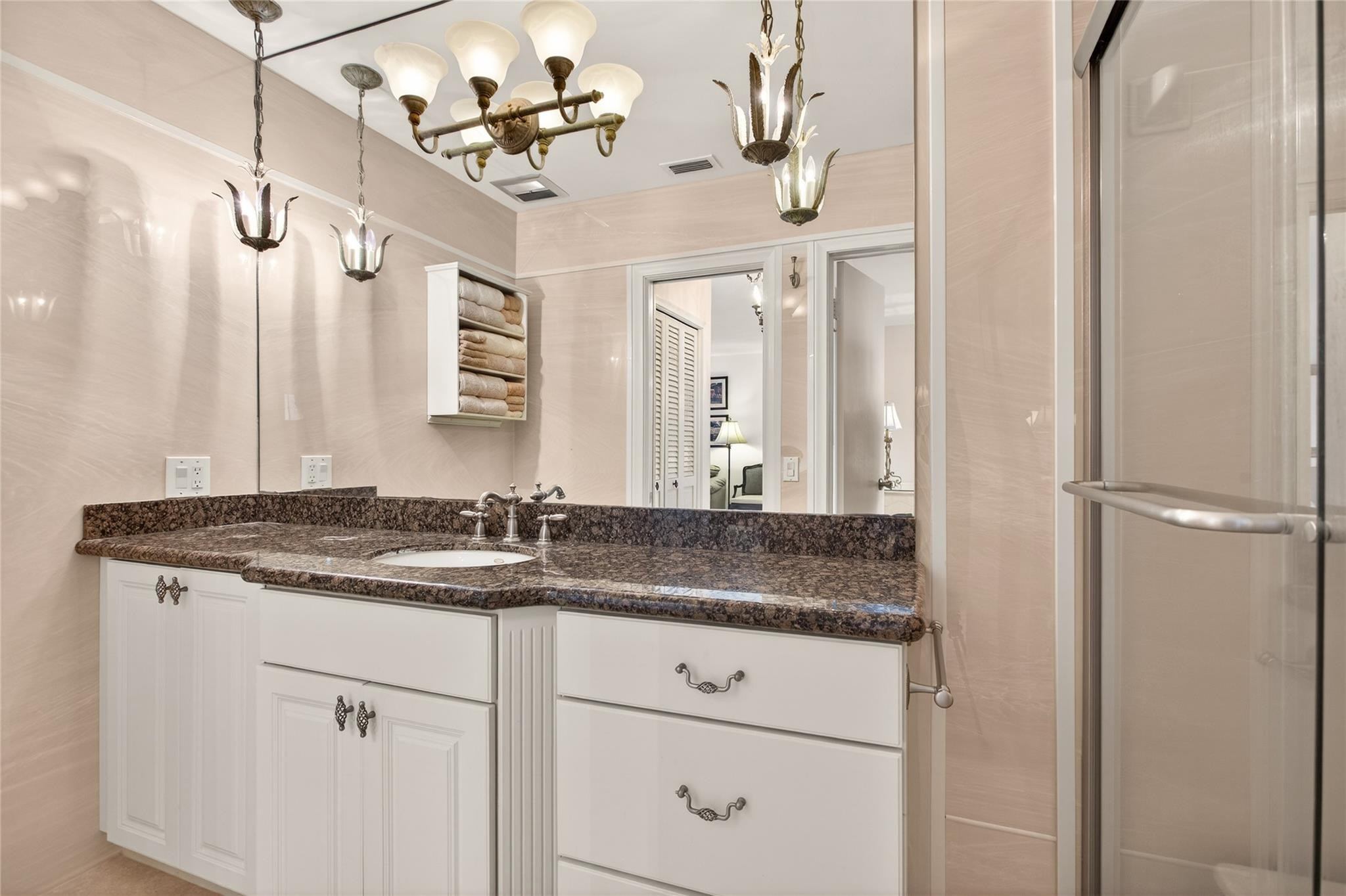 1001 North Riverside Drive, Unit 305 Pompano Beach, FL 33062 - Photo 26 of 44 a bathroom with a granite countertop sink a mirror and vanity