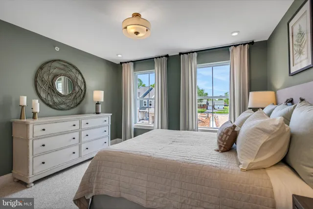 a bedroom with a bed and a night stand