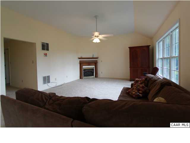 210 Moore Road Ruckersville, VA 22968 - Photo 6 of 18 a living room with furniture window and a lamp