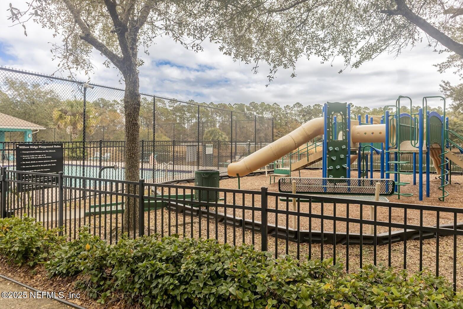 3680 Kirkpatrick Circle, Unit 5 Jacksonville, FL 32210 - Photo 9 of 10 a view of a balcony with a floor to ceiling window and wooden fence