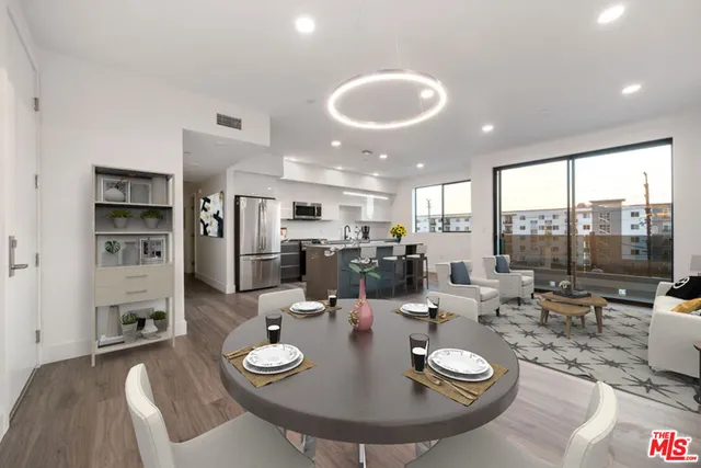 a large kitchen with a table and chairs