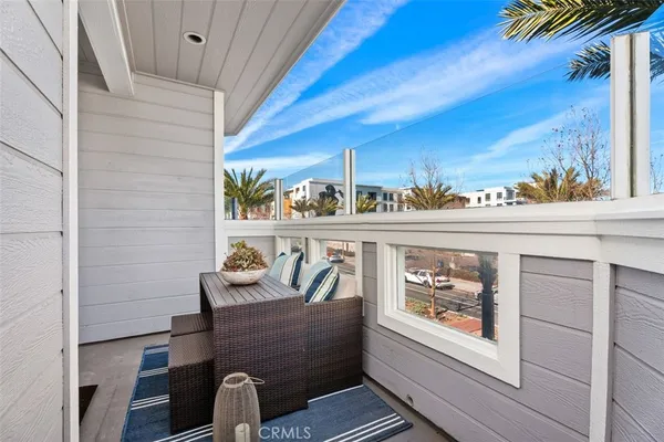 a front view of a house with outdoor seating and stairs