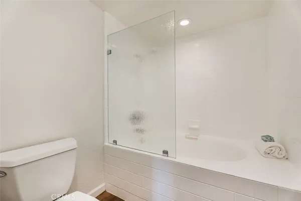 a bathroom with a shower and a toilet