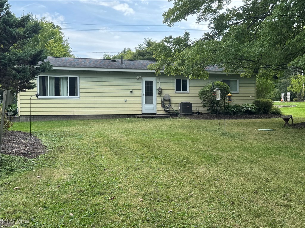 8810 Auburn Road Chardon, OH 44024 - Photo 19 of 22 Back of house featuring a lawn