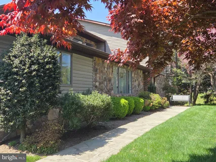 a backyard of a house with lots of green space