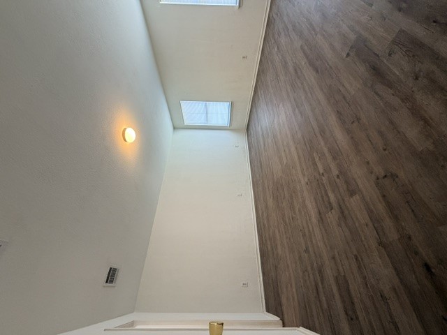 18421 Crestwind Lane Elgin, TX 78621 - Photo 21 of 34 Rich wood-textured flooring contrasts beautifully with smooth walls in this versatile living space.