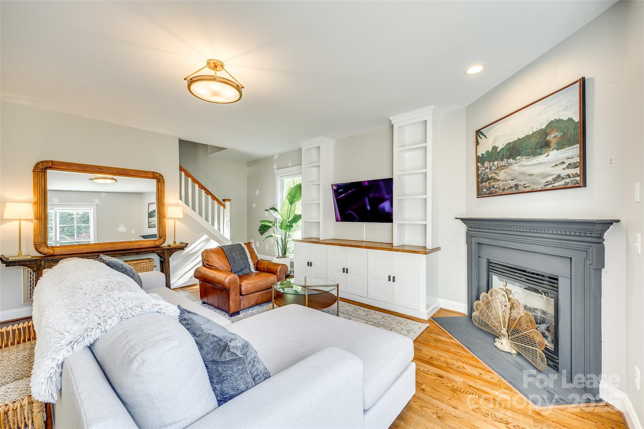 1128 Windsong Bay Lane Fort Mill, SC 29708 - Photo 12 of 35 a living room with furniture and a flat screen tv