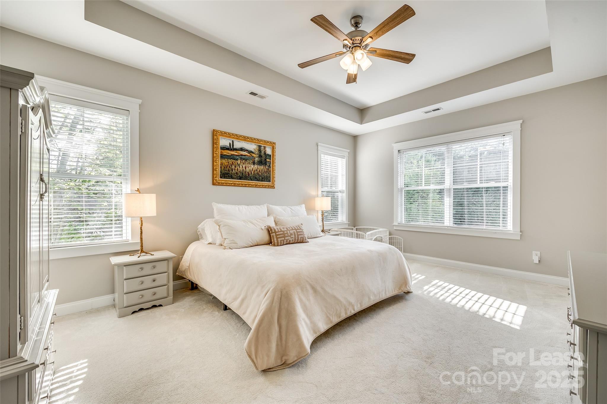 1128 Windsong Bay Lane Fort Mill, SC 29708 - Photo 17 of 35 a bedroom with a large bed and two windows