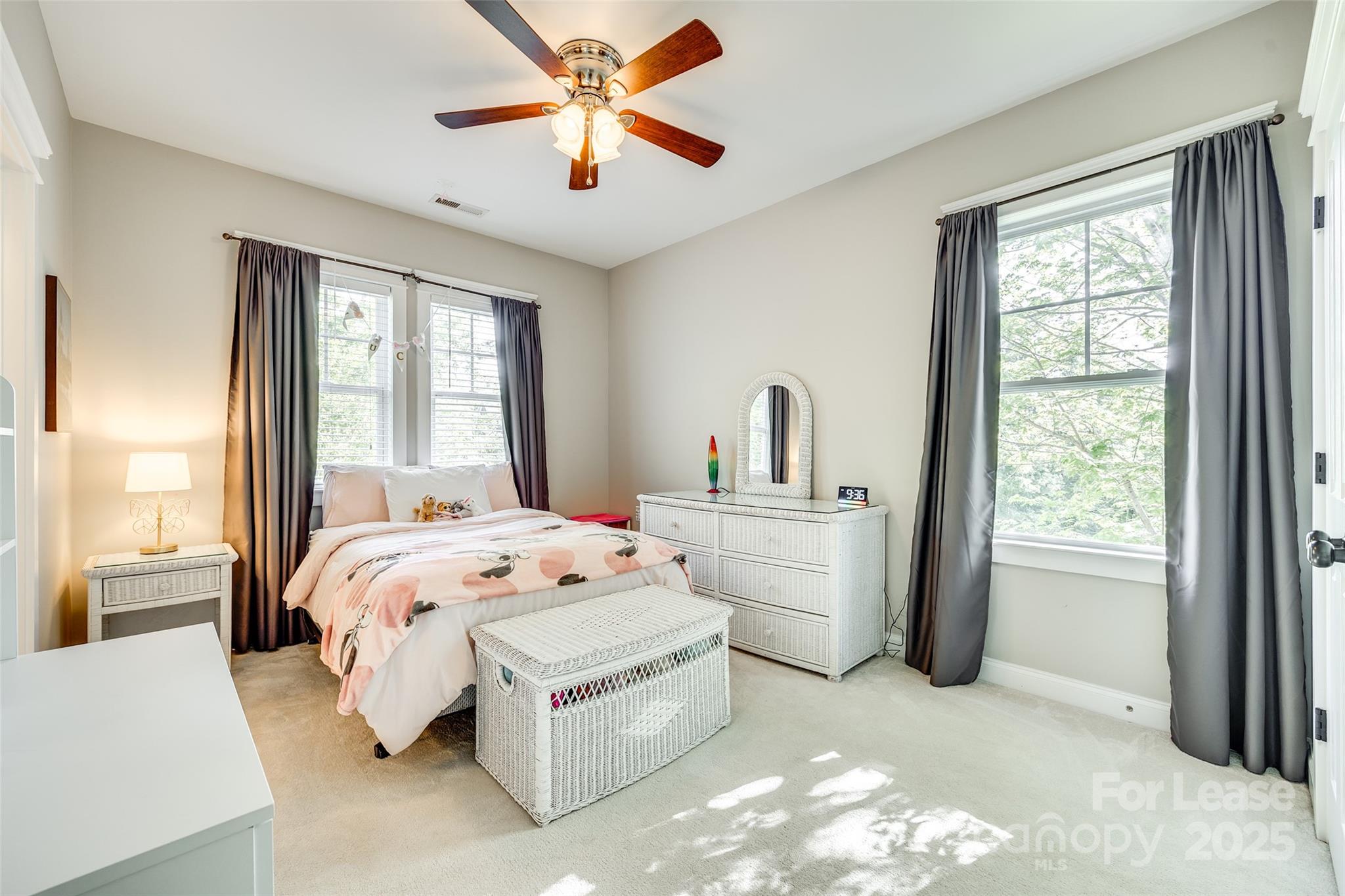 1128 Windsong Bay Lane Fort Mill, SC 29708 - Photo 21 of 35 a bedroom with a bed and a large window