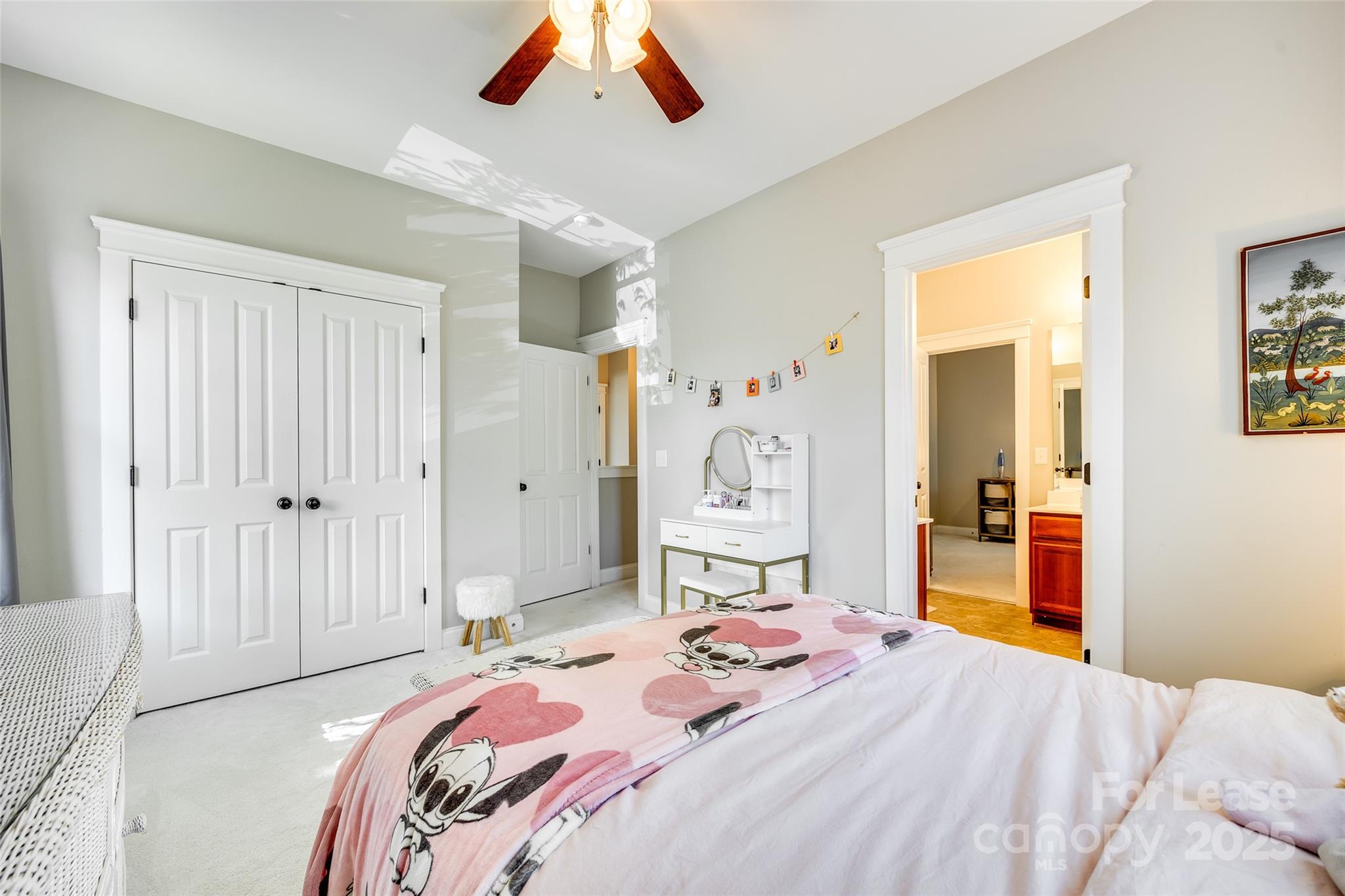 1128 Windsong Bay Lane Fort Mill, SC 29708 - Photo 22 of 35 a bedroom with a bed and a chandelier