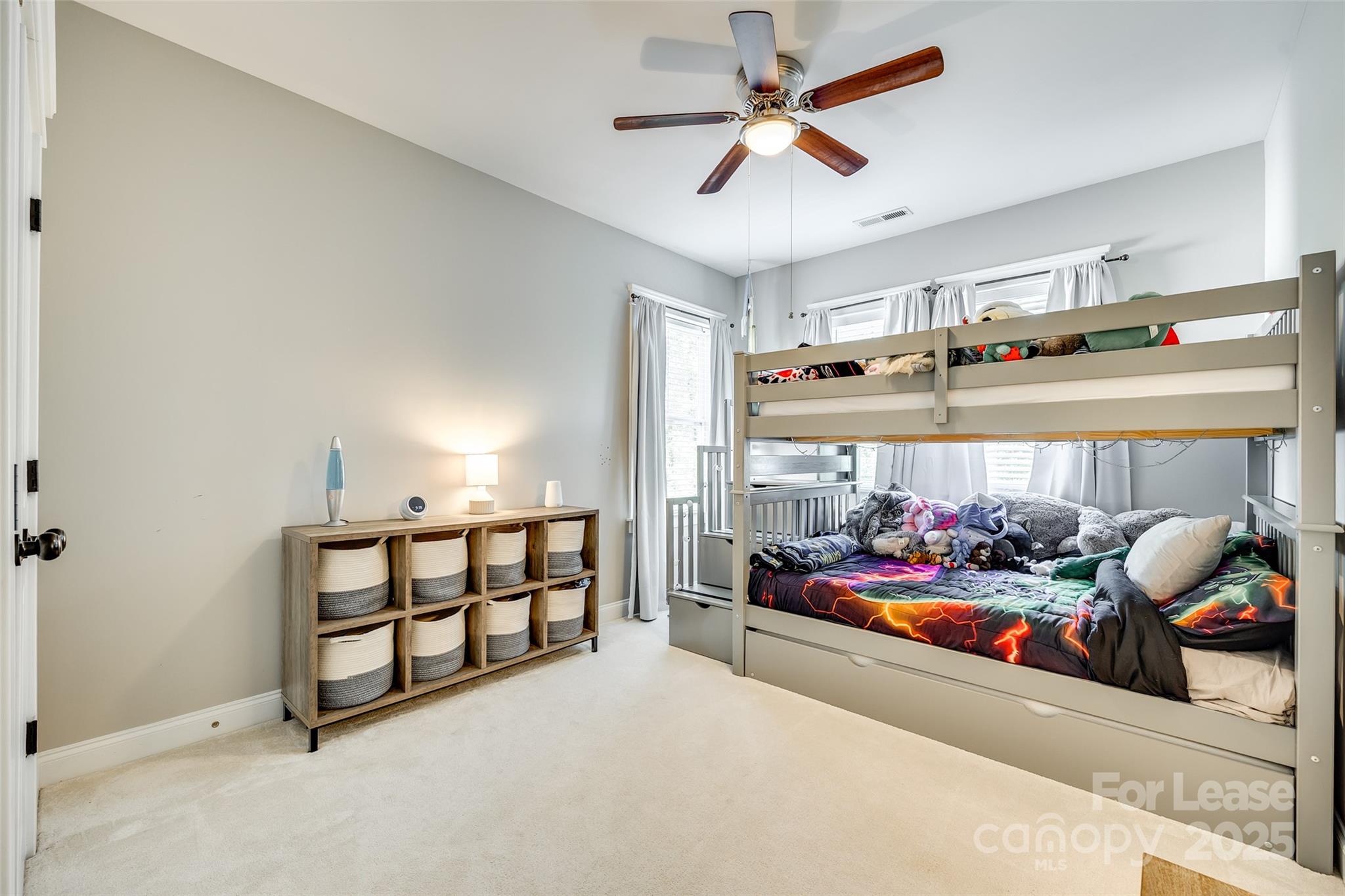 1128 Windsong Bay Lane Fort Mill, SC 29708 - Photo 23 of 35 a living room with lots of furniture and white walls